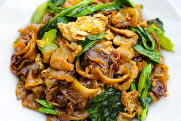 Stir-fried rice noodles with soy sauce and pork
