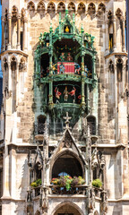 Panoramic view of theatrical puppet show on tower in Marienplatz town hall of Marien Square in...