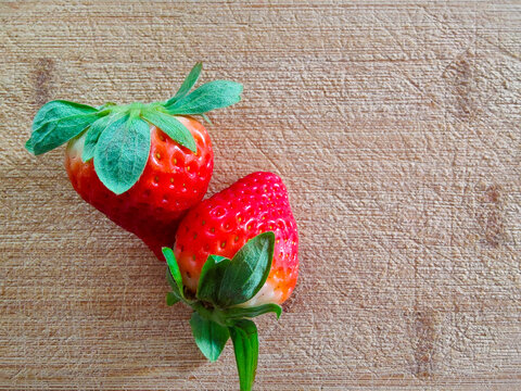 Whole Strawberries on Cutting Board