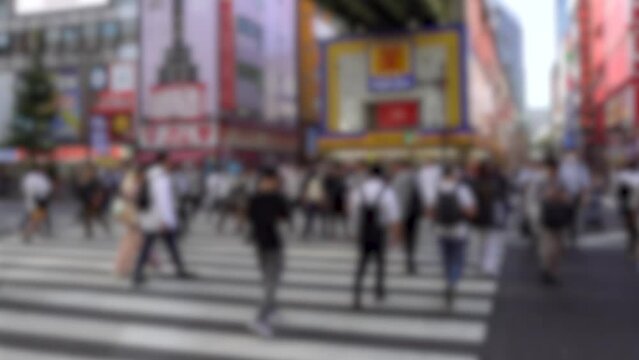 Blurred People Crossing Street in Akihabara, Japan