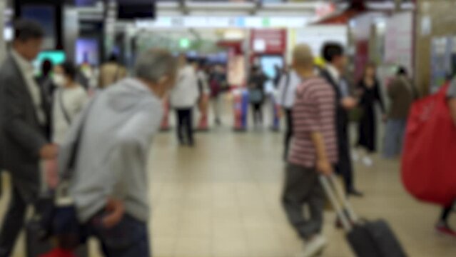 Blurred Commuters and Businessmen Inside Tokyo Metro Station During Rush Hour