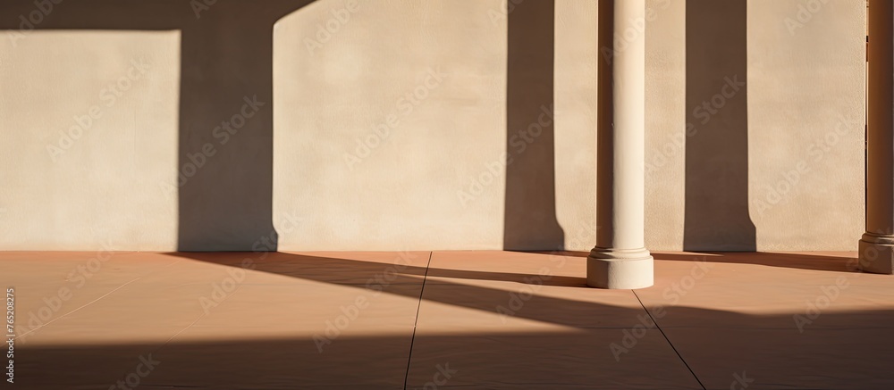 Poster the shadows of the columns create a pattern on the hardwood flooring and wall of the building, addin