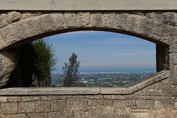 Panoramic view of Romagna coast from a window in a stone wall