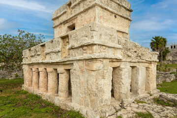 Casa del Chultúnbeing visited by an Iguana