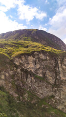 Obraz premium Huge canyon formed by very high vertical walls, inside it runs a river that forms some waterfalls. It is located in Serra do Cipó, Brazil