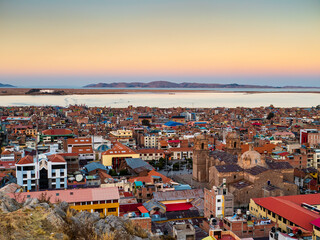 Impressive aerial view of lake Titicaca at sunset from Huajsapata Hill viewpoint, Puno, Peru - obrazy, fototapety, plakaty