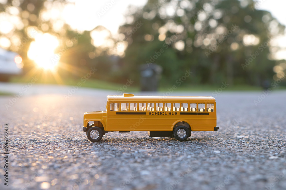 Wall mural small model of american yellow school bus as symbol of education in the usa