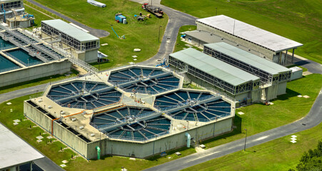 Aerial view of modern water cleaning facility at urban wastewater treatment plant. Purification...