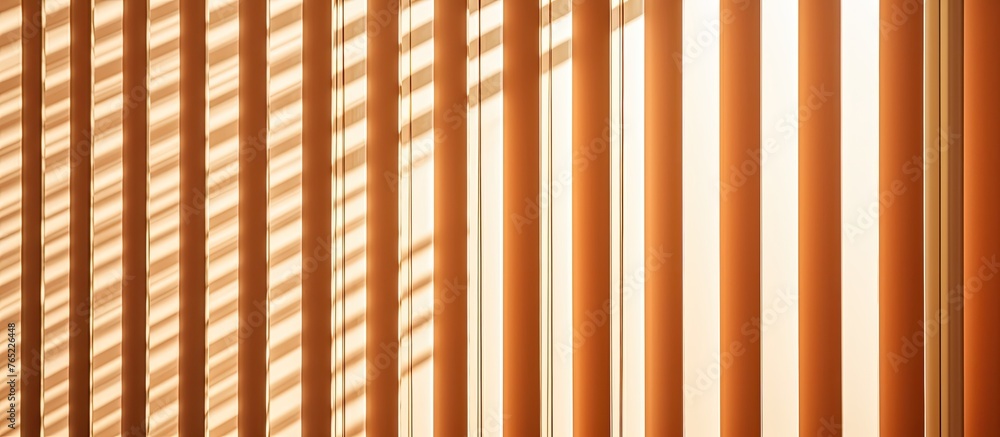 Poster blinds are neatly lined up in a room, framing a window in the background