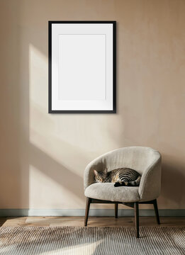 mockup of a blank frame, black outline, on a beige wall, green plant and cat sleeping on an armchair