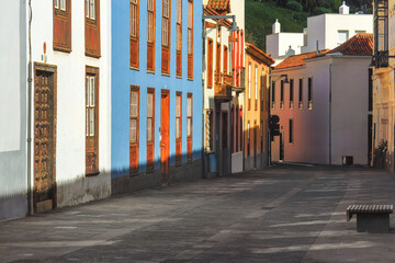 Charming view of a peaceful  Santa Cruz de Tenerife street in the morning light showcasing the vibrant colored buildings. Ideal for travel, architecture, serenity. Canary islands, Spain