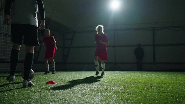 Little Girls Training Indoors In Soccer School, Workout Of Junior Soccer Team Before Competition