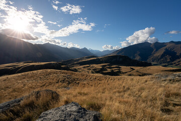 Hiking on vacation in New Zealand in a mountain landscape near Wanaka and Queenstown