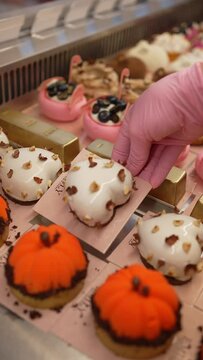 Elegant Display of Gourmet Pastries in a Boutique Patisserie. Assorted pastries on golden trays. Concept Artisan pastry showcase