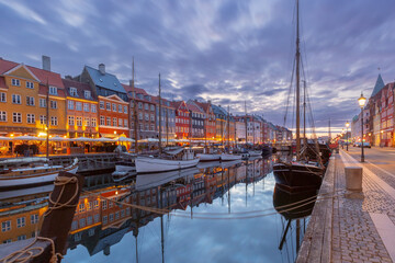 Nyhavn with colorful facades of old houses and ships in Old Town of Copenhagen, capital of Denmark. - 765248038