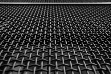 Close-up of a grate with a pattern of intertwined iron wires, Italy