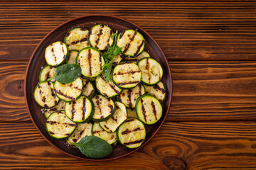 Healthy vegetarian food . Grilled green zucchini .