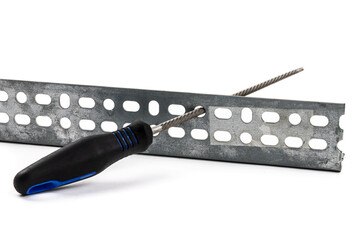 A round metalworking file in use in a piece of steel isolated on white