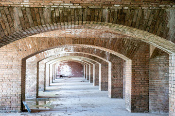 Endless brick passage with repeating archways in Fort Jefferson on Dry Tortugas National Park.