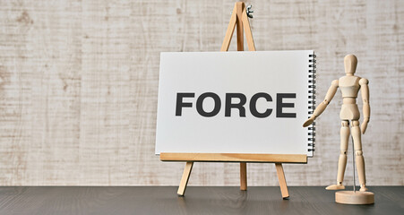 There is notebook with the word FORCE. It is as an eye-catching image.