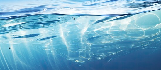 A stunning closeup of electric blue Arctic ocean water with the sun shining through, creating a mesmerizing natural landscape art - Powered by Adobe