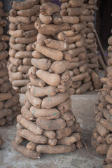 Fototapeta na wymiar Heap of yam tuber for sale in Bere market, Oyo, Nigeria on March 22, 2024.