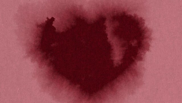 Abstract spots form a heart shape on animated craft paper