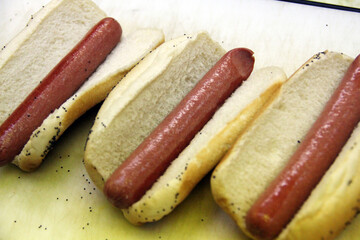 Three Plain Hotdogs on Sesame Buns Fast Food Restaurant in America