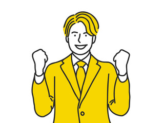 ガッツポーズをする若いスーツを着た男性