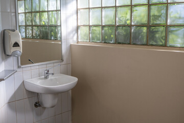 Vintage Bathroom Interior with Single wash-basin, a mirror, a Soap Dispenser Holder and Natural...