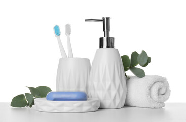 Fototapeta na wymiar Bath accessories. Different personal care products and eucalyptus branches on table against white background