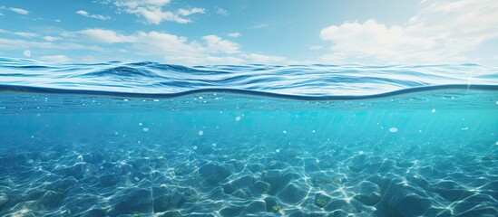 Scenic view of the ocean with crystal-clear water reflecting the clear blue sky on a peaceful day