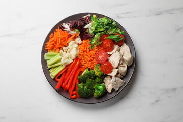 Balanced diet and healthy foods. Plate with different delicious products on white marble table, top view
