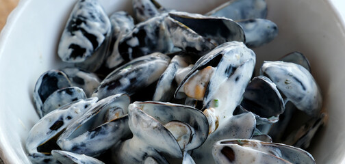 close up of marinieres mussels, a French recipe with shallot and white wine