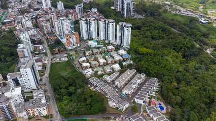 Aerial view of the city of Armenia, Quindío, Colombia. Buildings in the city of Armenia between trees