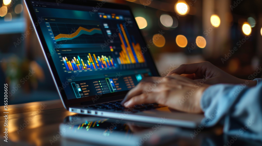 Poster a person is typing on a laptop with a stock market graph on the screen. the person is focused on the