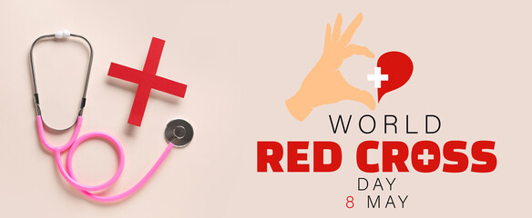 Stethoscope and red cross on light background