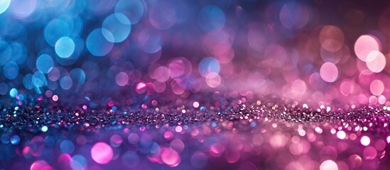 Abstract blue and purple glitter wallpaper with bokeh background