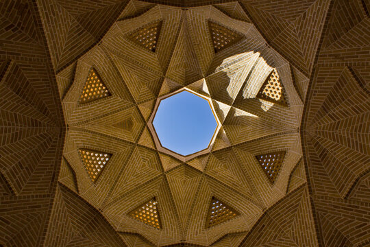Detail of the dome of the Abbasi caravanserai in Meybod, Yazd, Iran with eye catching details of brick work.
