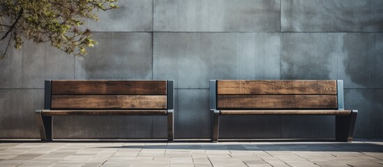 A pair of wooden seating arrangements placed next to each other on a paved walkway
