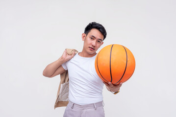 Confident Asian man posing with basketball, challenging someone on a 1 on 1 game. Casual style on...