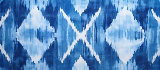A close up of an electric blue and white ikat pattern on fabric, showcasing symmetry and a world of engineering and science behind the intricate circle design - obrazy, fototapety, plakaty