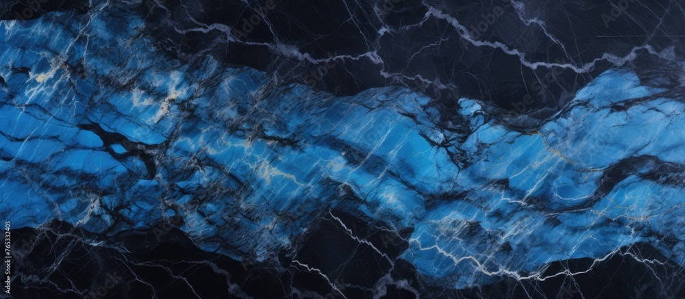 Poster the image captures a detailed view of a blue marble slab against a solid black background, emphasizi