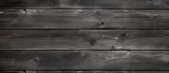 Naklejka premium An up-close view of a wooden wall against a black background