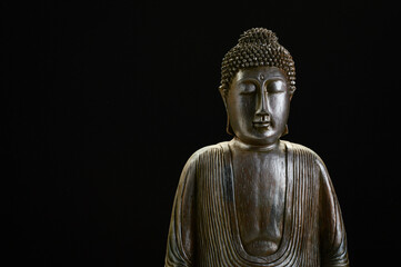 Buddha statue with black background 