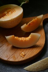 Melon sliced  on a wooden board