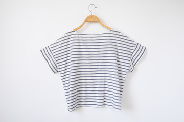 Summer blouse is clothes hanger on white background.