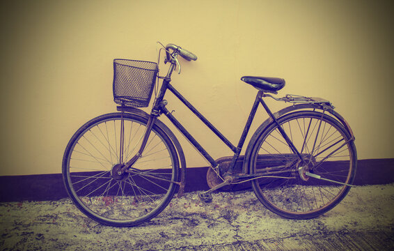 Vintage Bicycle Against Grunge Wall