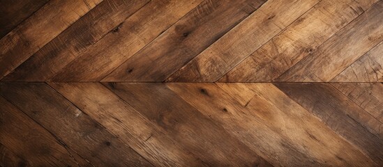 A closeup of brown hardwood flooring with a chevron pattern, showcasing the natural beauty of wood in a bedrocklike design