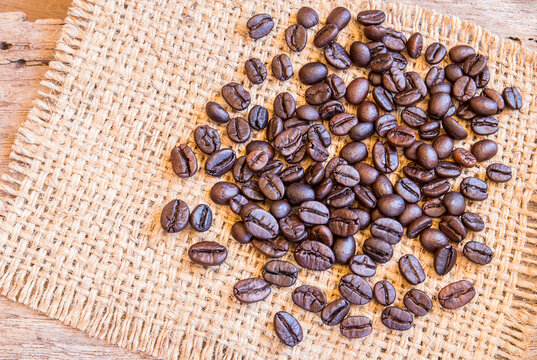 Roasted coffee beans on burlap sack